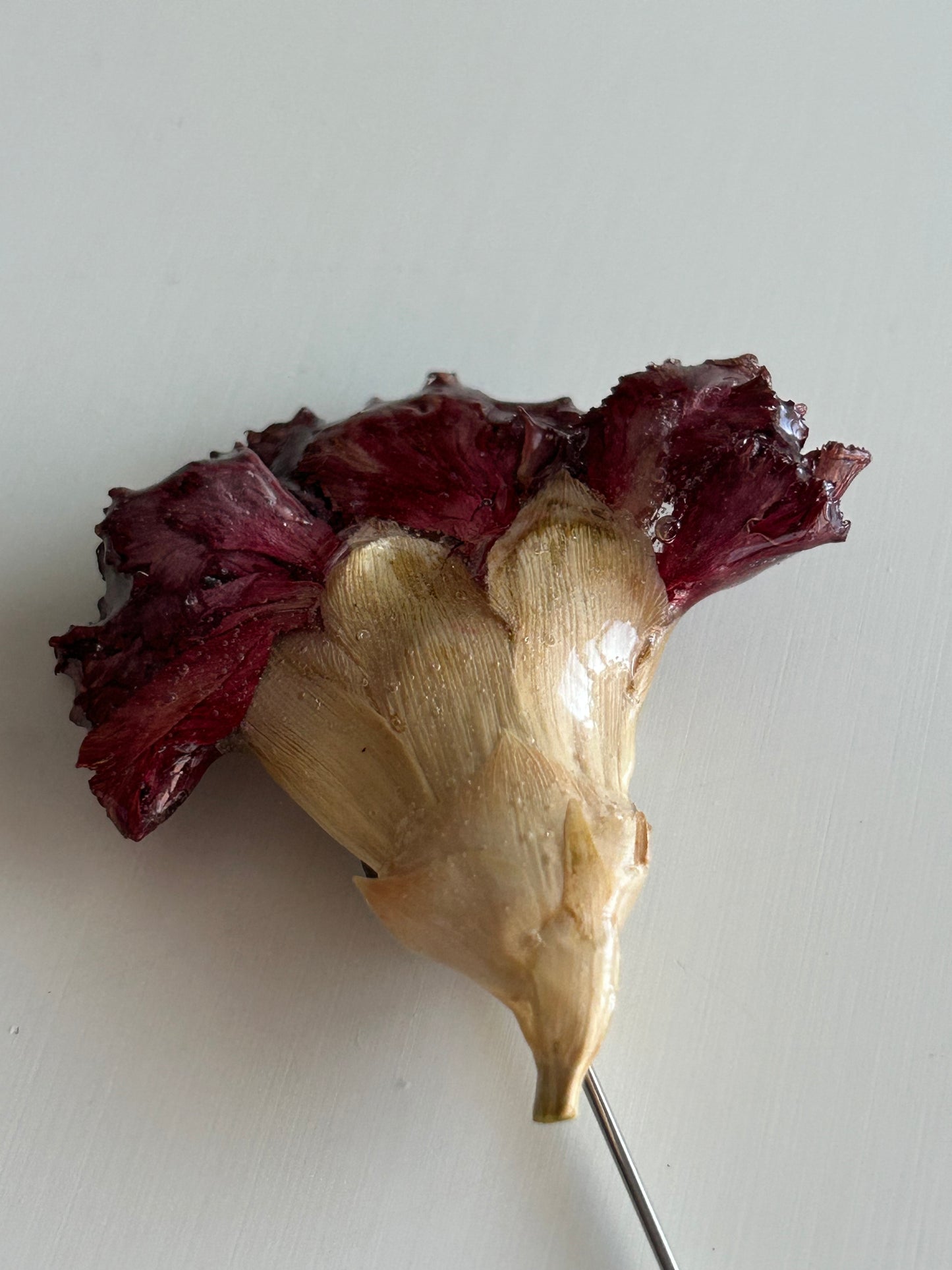 pregadeira cravo vermelho