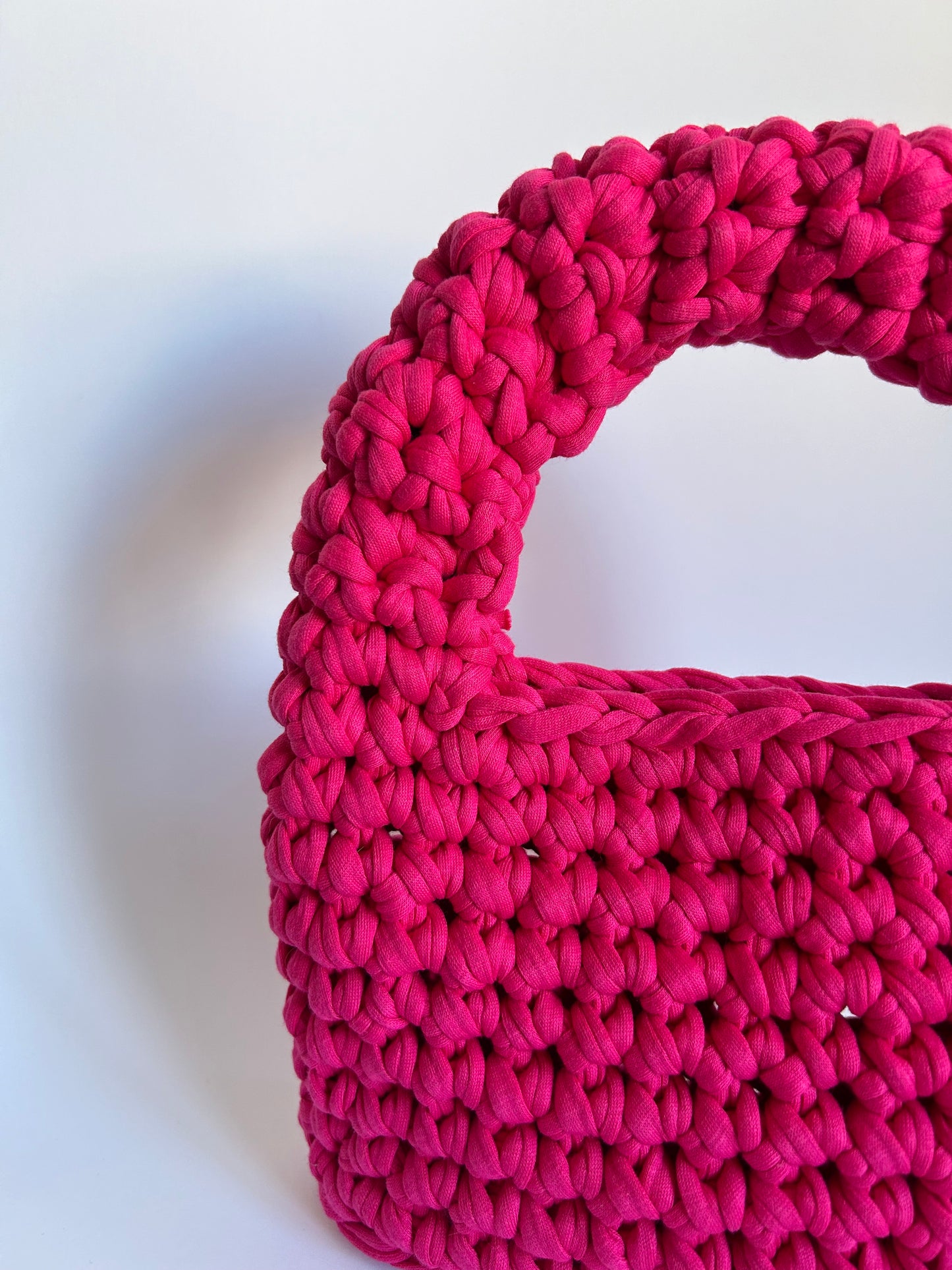 pink crochet handbag